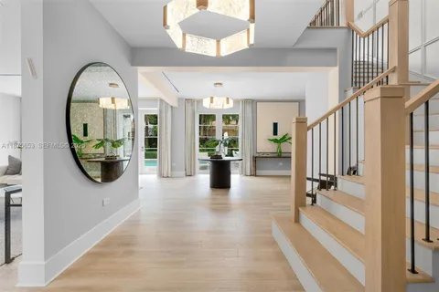 workspace with wooden floor mirror and windows