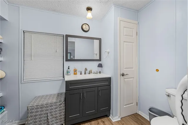a kitchen with cabinets and window