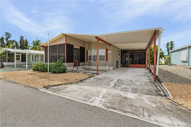 a view of a house next to a yard