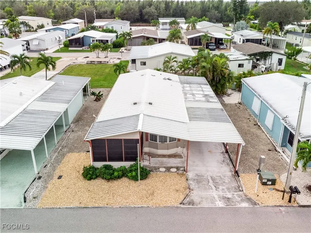a view of a patio with a table and chairs