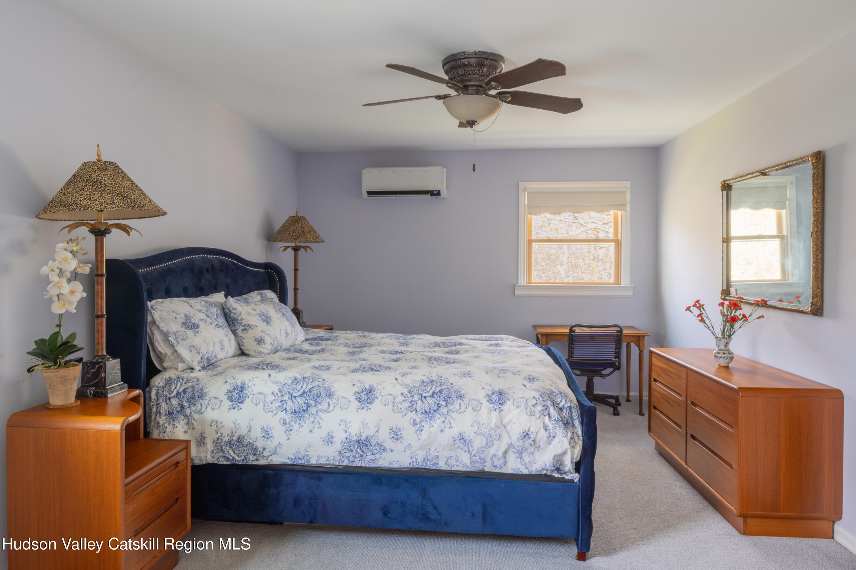 1 Stone Ridge Court Woodstock, NY 12498 - Photo 16 of 30 a bedroom with a bed and a chandelier