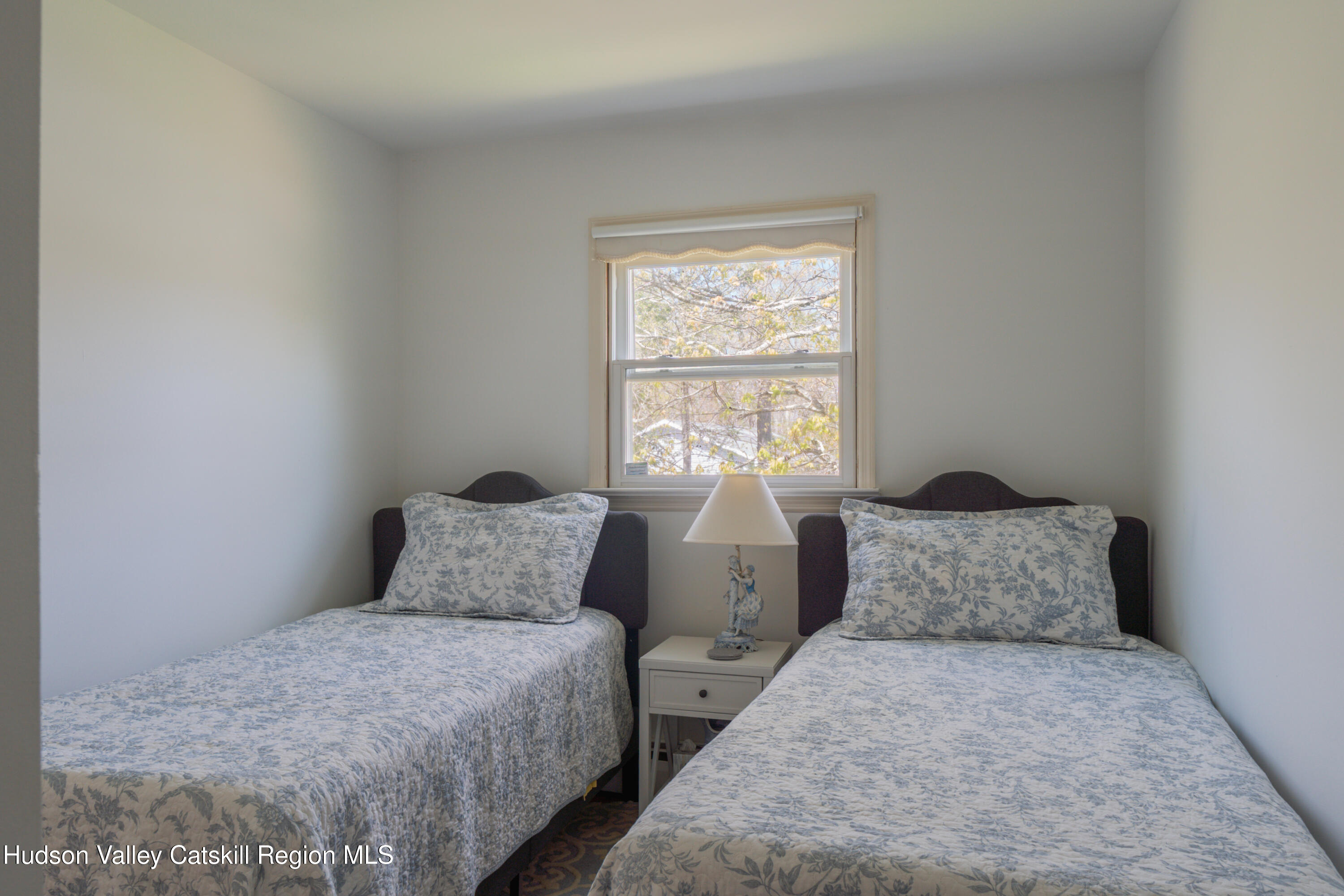 1 Stone Ridge Court Woodstock, NY 12498 - Photo 20 of 30 a bedroom with two beds and a window