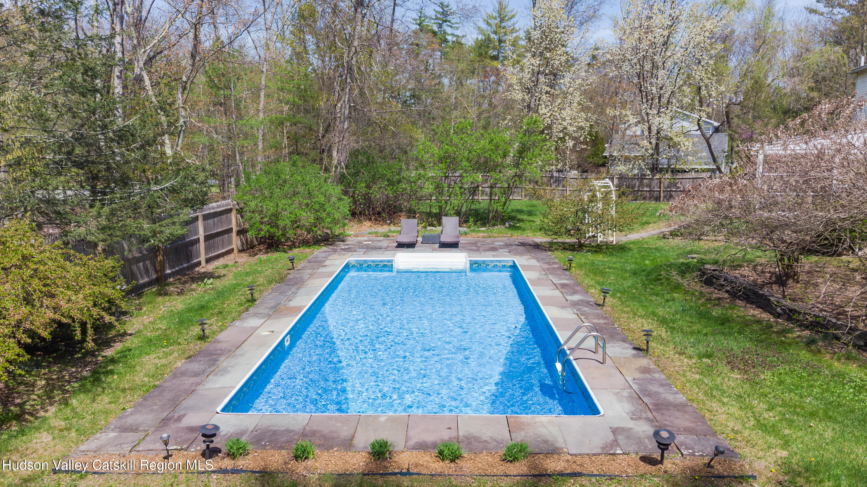 1 Stone Ridge Court Woodstock, NY 12498 - Photo 29 of 30 a backyard of a house with table and chairs