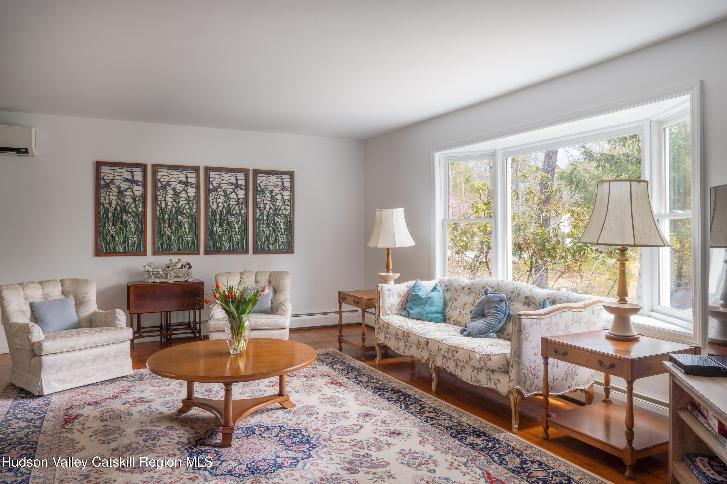 1 Stone Ridge Court Woodstock, NY 12498 - Photo 5 of 30 a living room with furniture potted plant and a large window