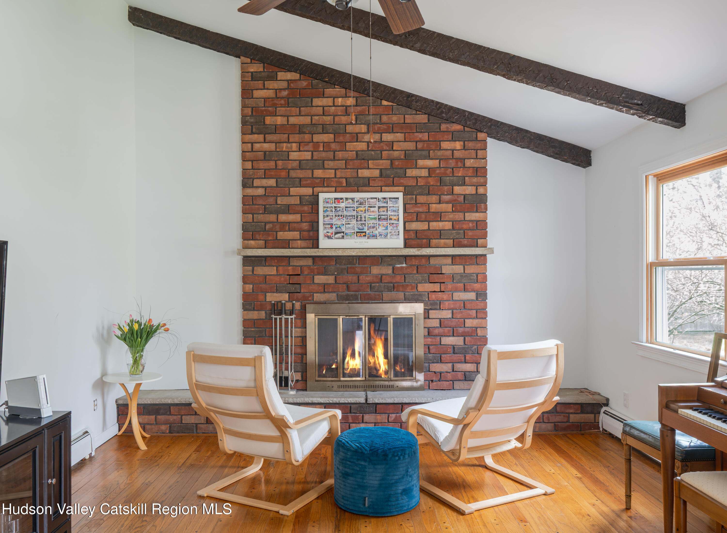 1 Stone Ridge Court Woodstock, NY 12498 - Photo 9 of 30 a living room with furniture and a fireplace