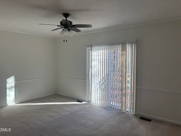 an empty room with a empty space and a ceiling fan
