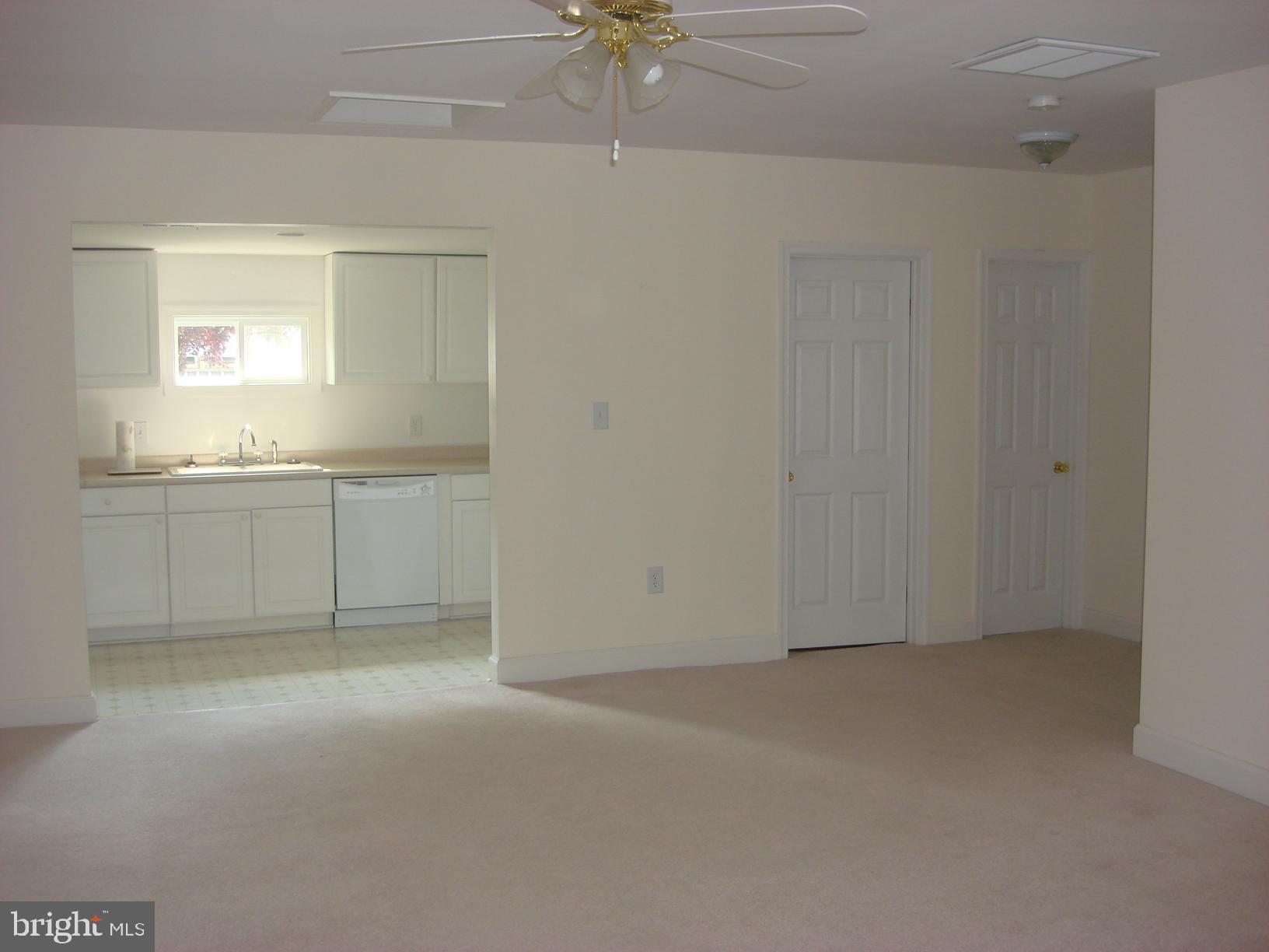 17813 A Willow Road Dumfries, VA 22026 - Photo 3 of 7 Spacious living room opens to full kitchen