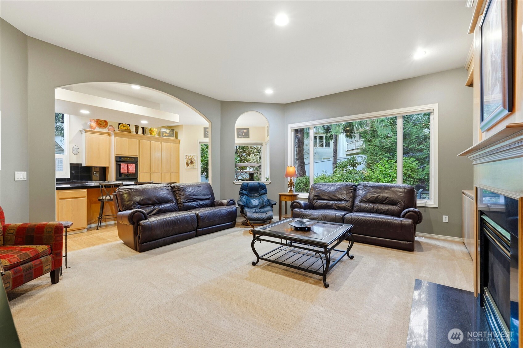 5633 194th Lane Southeast Issaquah, WA 98027 - Photo 21 of 40 a living room with furniture and a fireplace