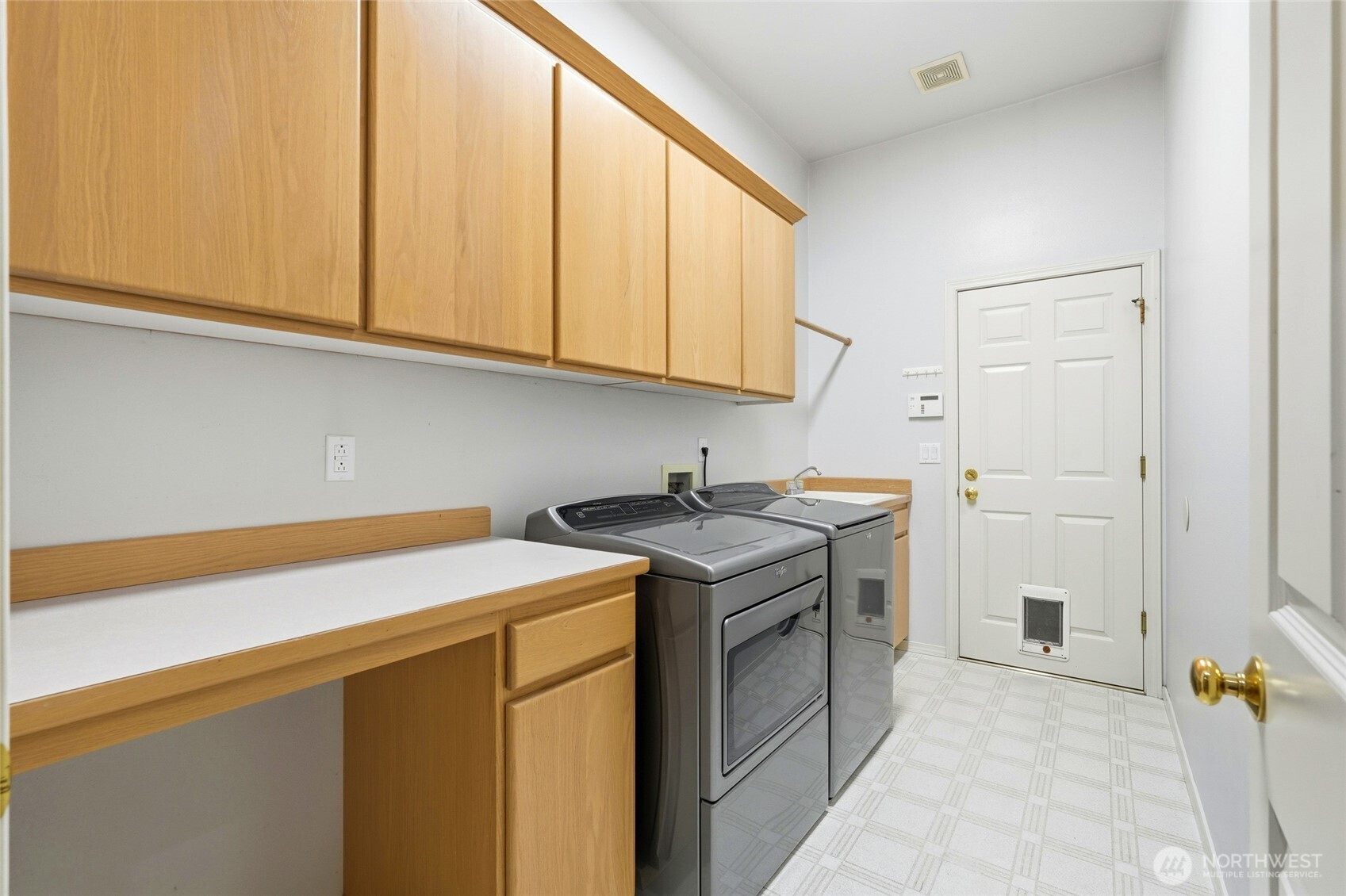 5633 194th Lane Southeast Issaquah, WA 98027 - Photo 26 of 40 a utility room with sink dryer and washer