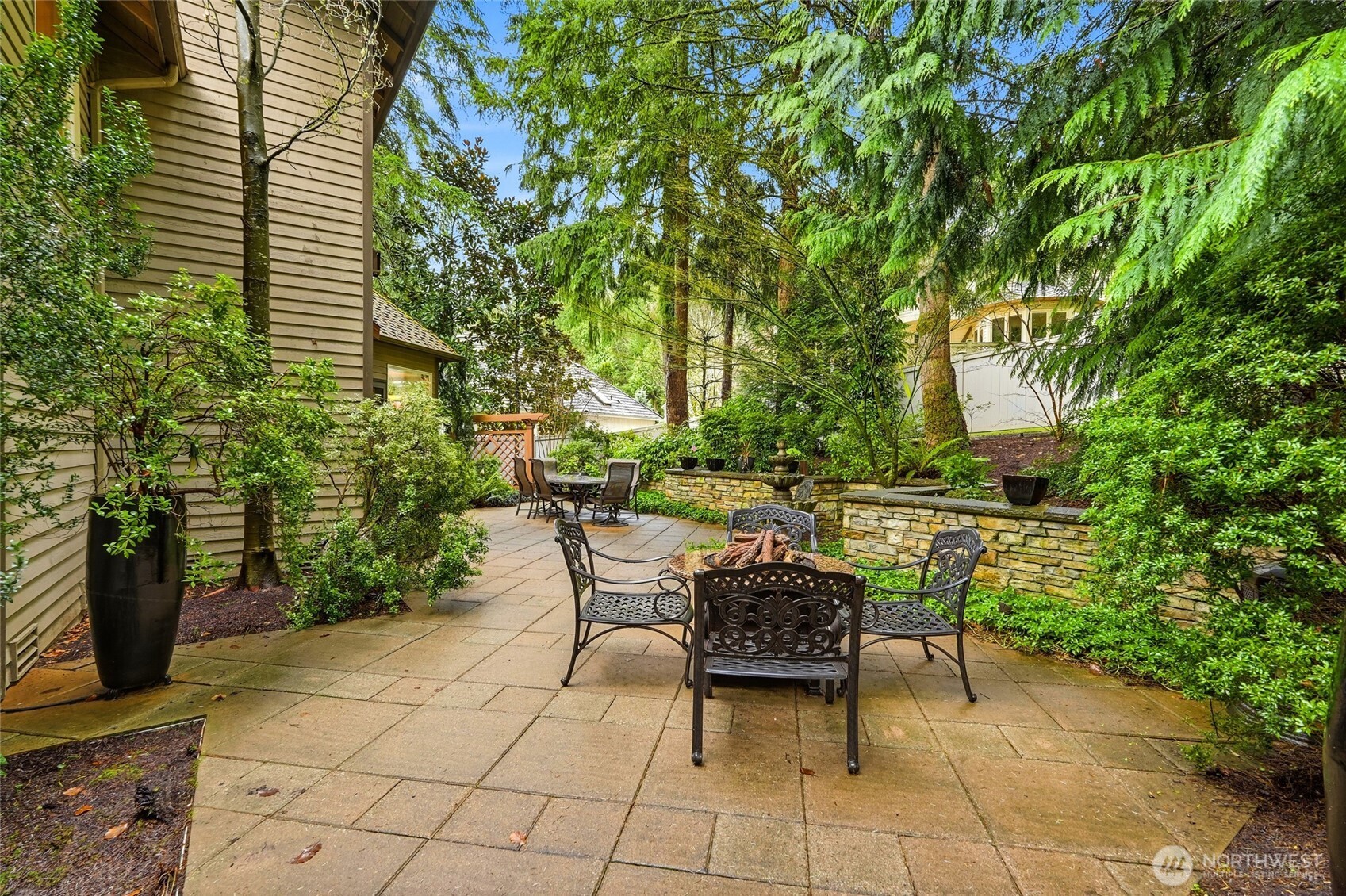 5633 194th Lane Southeast Issaquah, WA 98027 - Photo 32 of 40 a view of backyard with seating space and trees