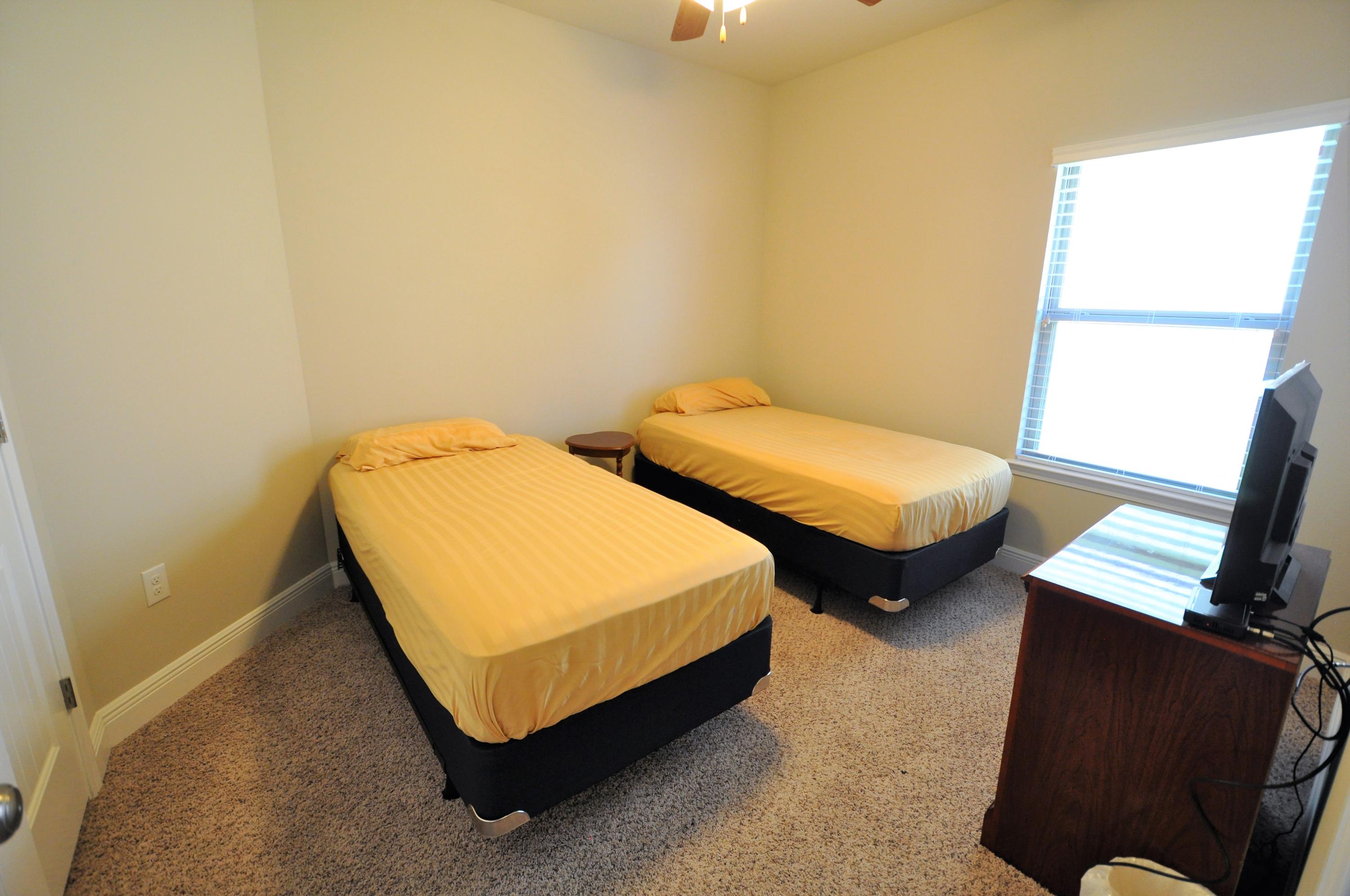 281 Pin Oak Loop Santa Rosa Beach, FL 32459 - Photo 13 of 21 a bedroom with two beds and a desk