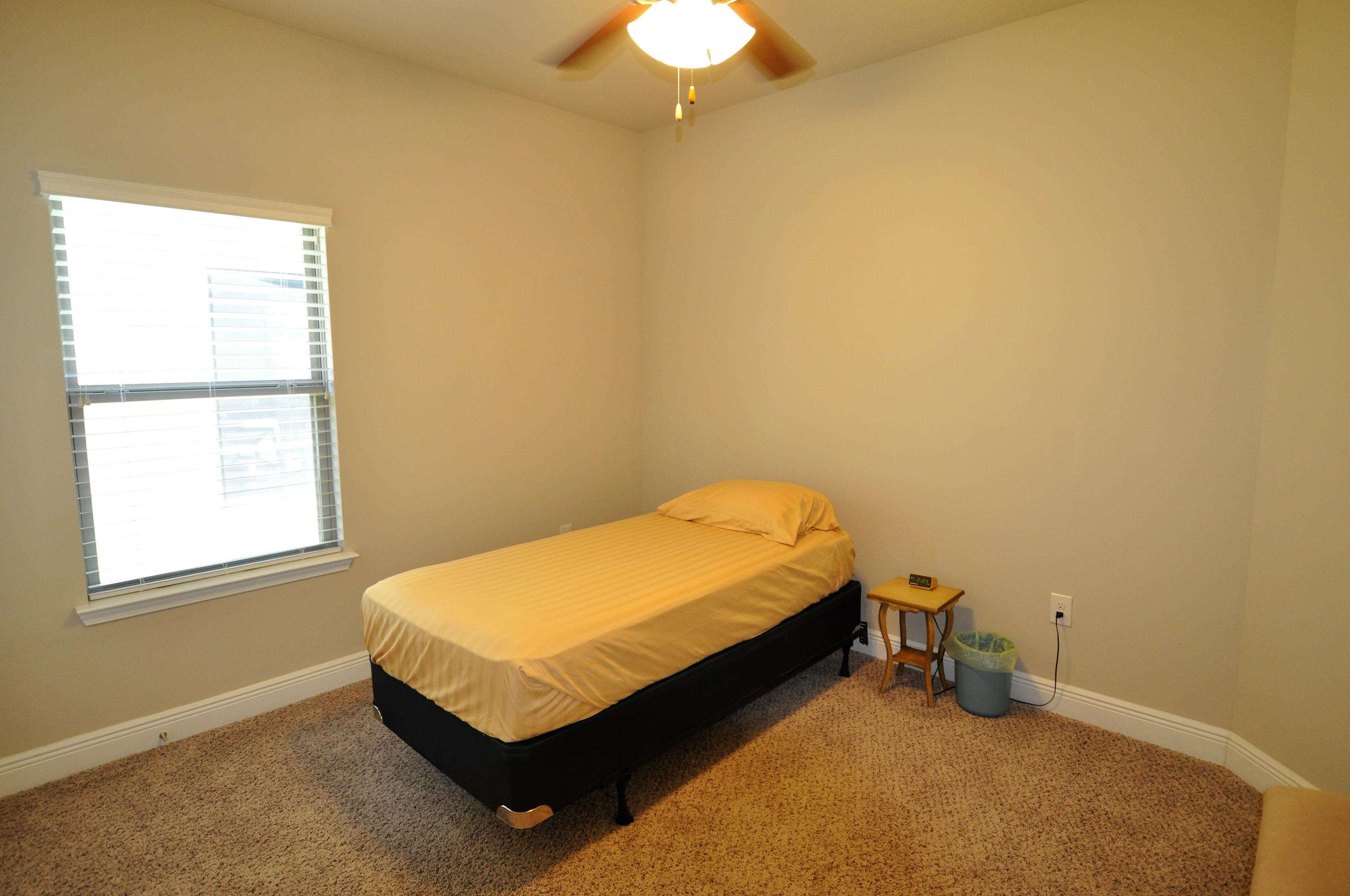 281 Pin Oak Loop Santa Rosa Beach, FL 32459 - Photo 15 of 21 a bed sitting in a room next to a window