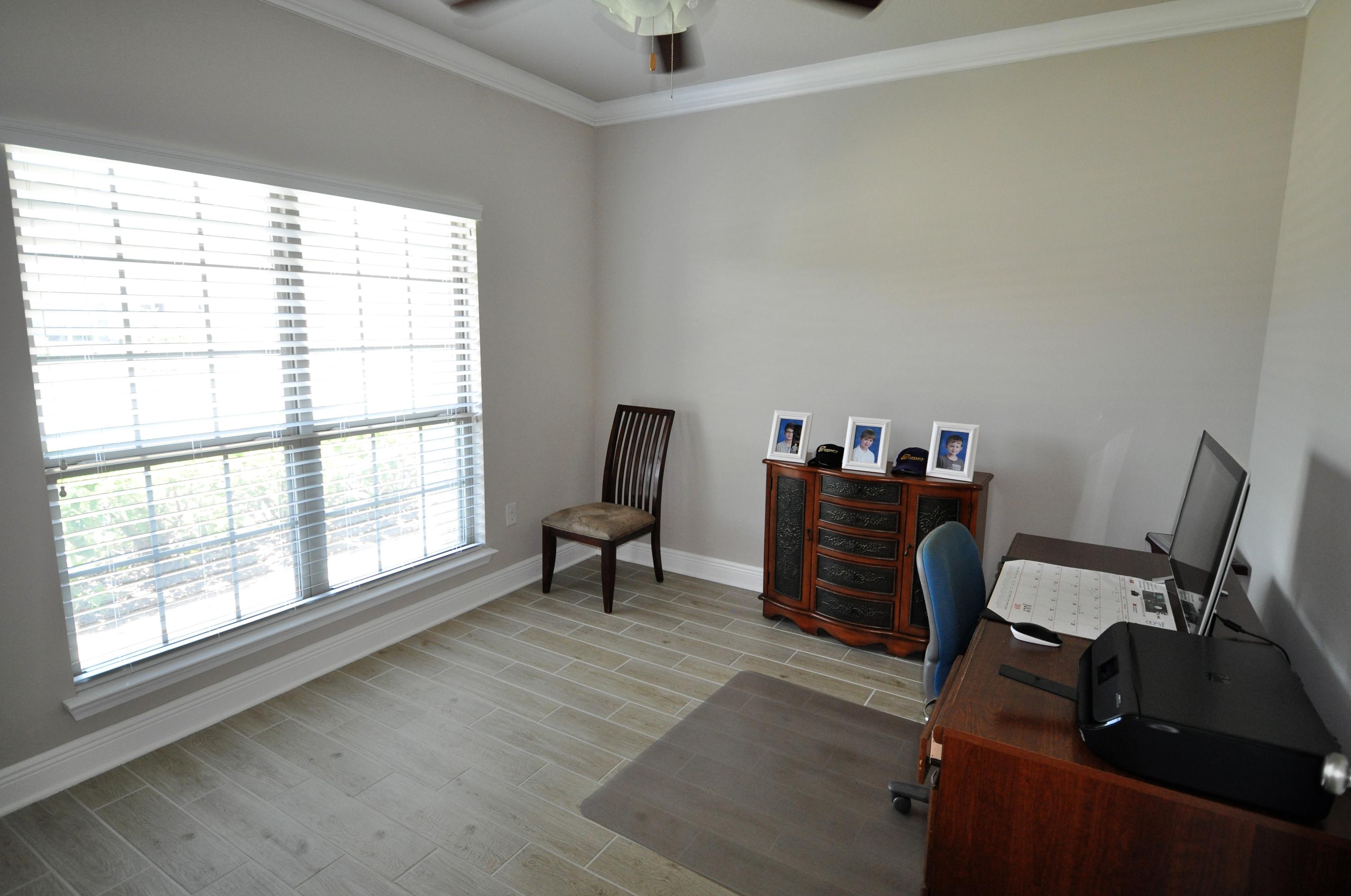 281 Pin Oak Loop Santa Rosa Beach, FL 32459 - Photo 16 of 21 a view of a workspace with furniture and a window