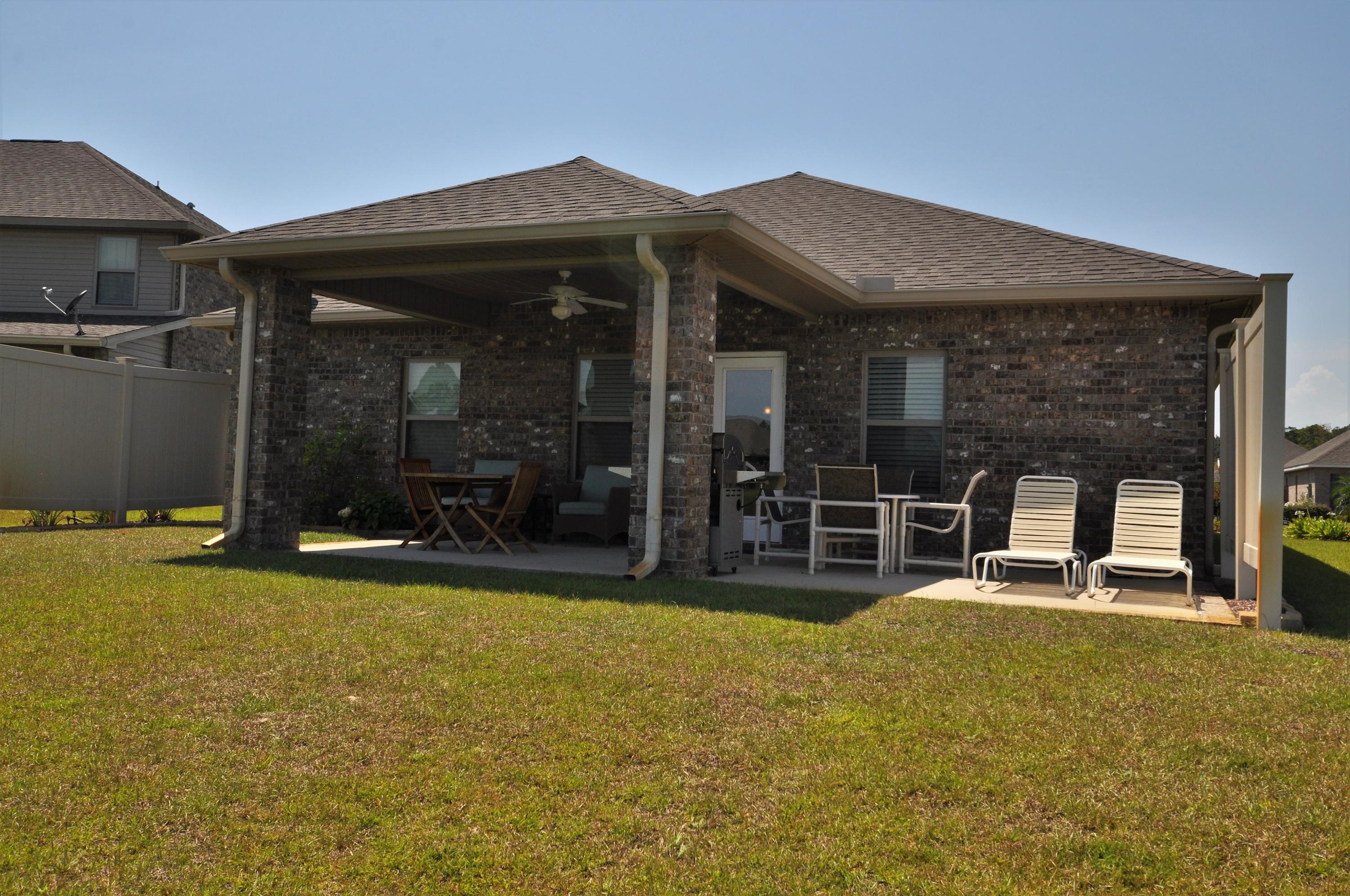 281 Pin Oak Loop Santa Rosa Beach, FL 32459 - Photo 20 of 21 a view of a house with swimming pool and porch