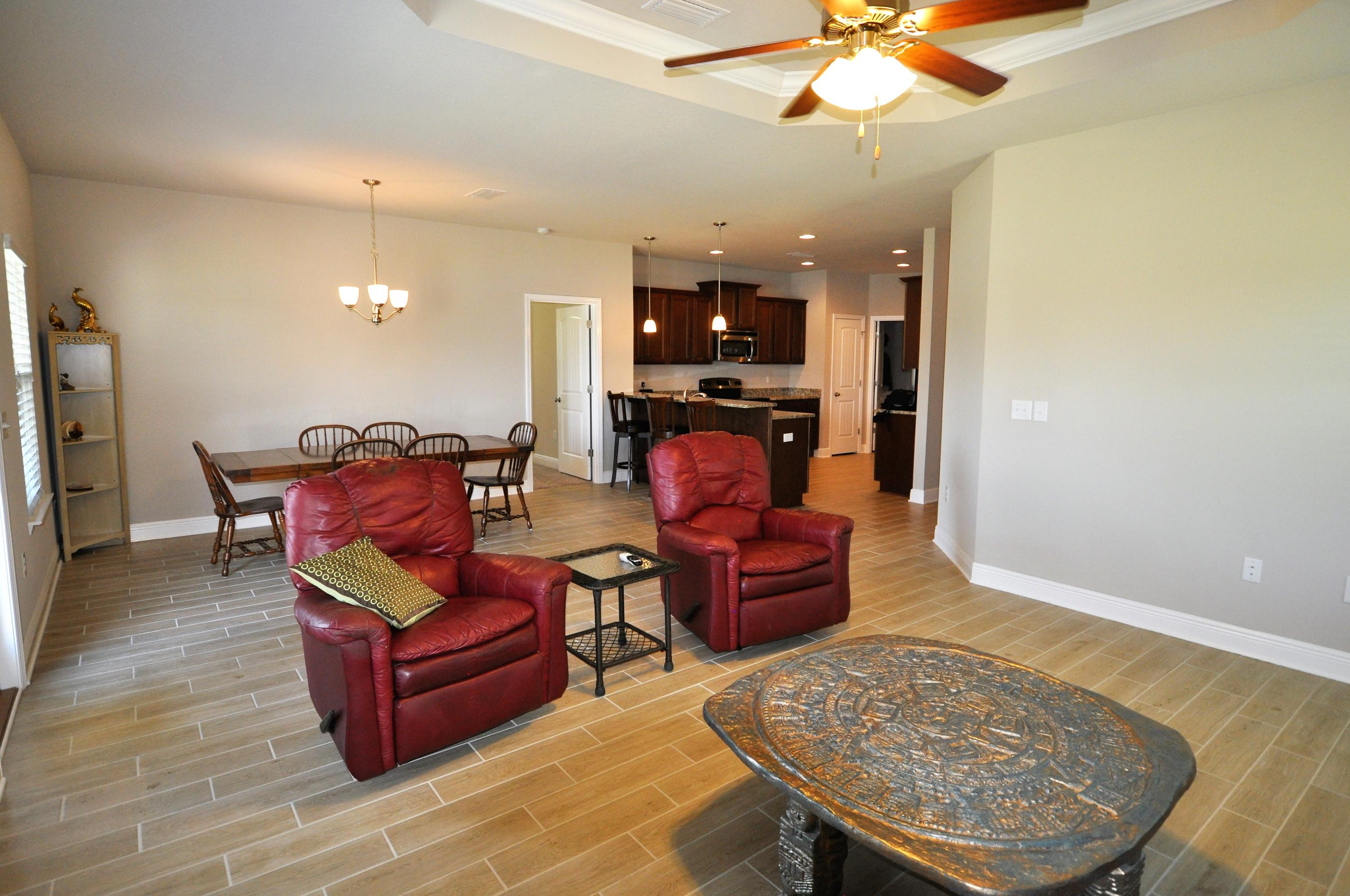 281 Pin Oak Loop Santa Rosa Beach, FL 32459 - Photo 8 of 21 a living room with furniture and a flat screen tv