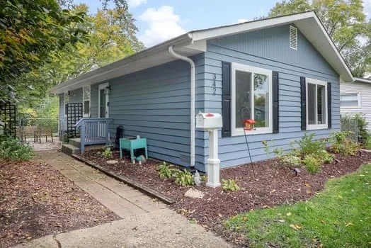 a front view of house with small garden