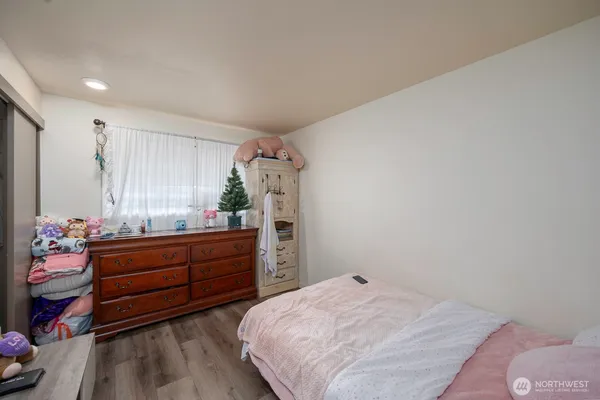 a bed room with a bed and a dresser