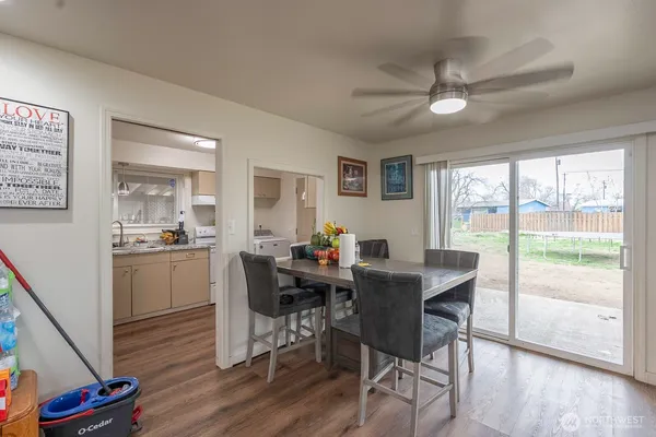 a view of a dining room with furniture window and wooden floor