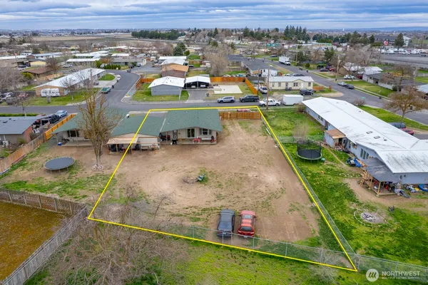 an aerial view of a house with a lake view