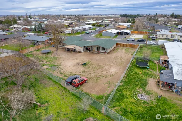 an aerial view of residential houses with outdoor space