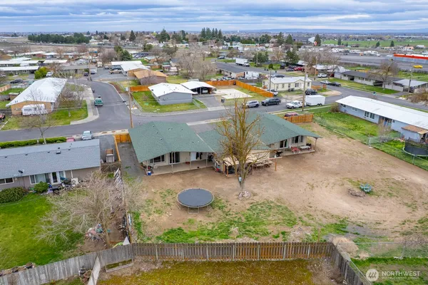 an aerial view of a house with a swimming pool