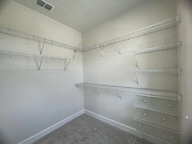 a view of a room with racks on the wall
