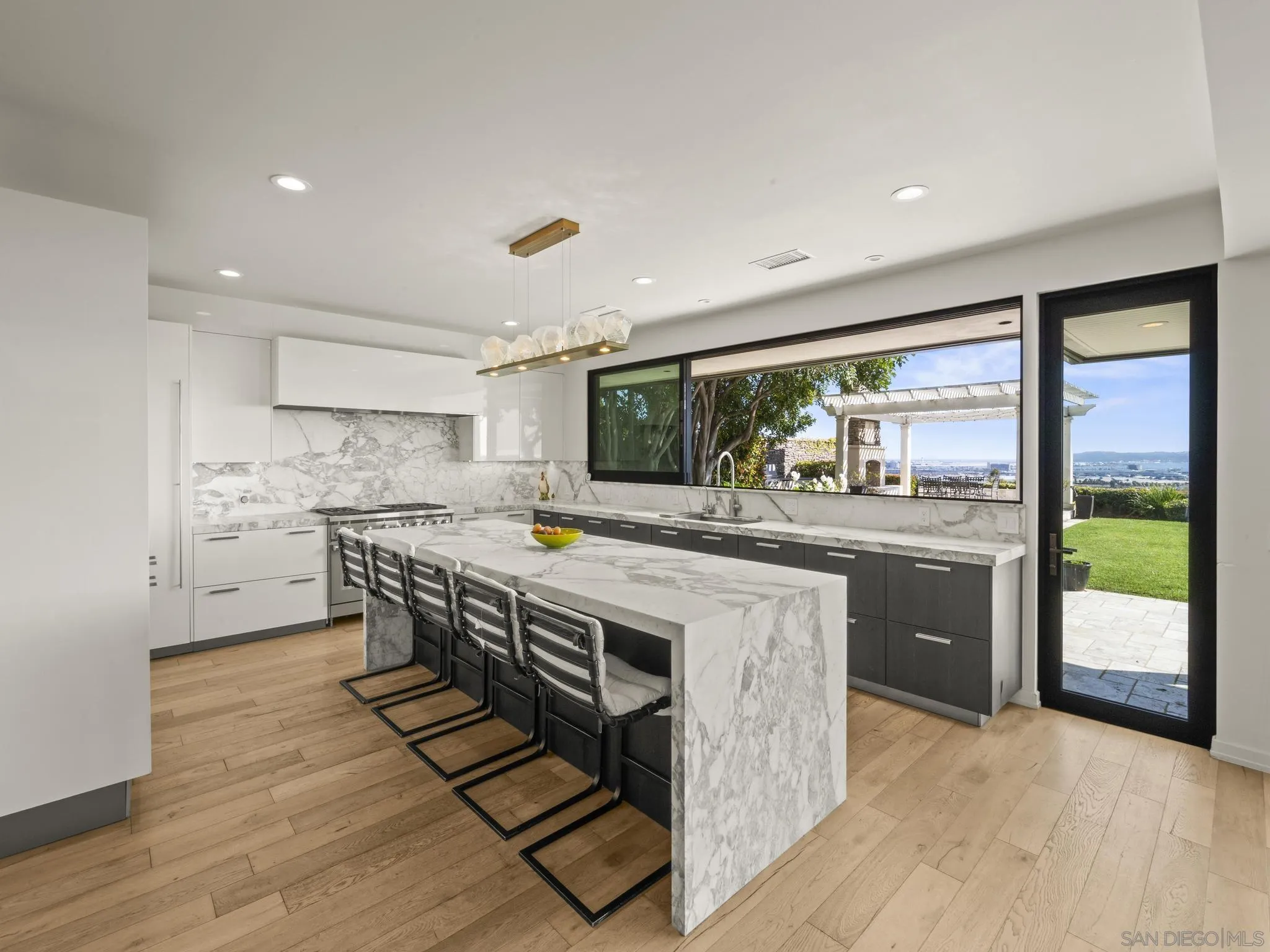 2323 San Juan Road San Diego, CA 92103 - Photo 11 of 47 a kitchen with stainless steel appliances a stove a sink and a refrigerator