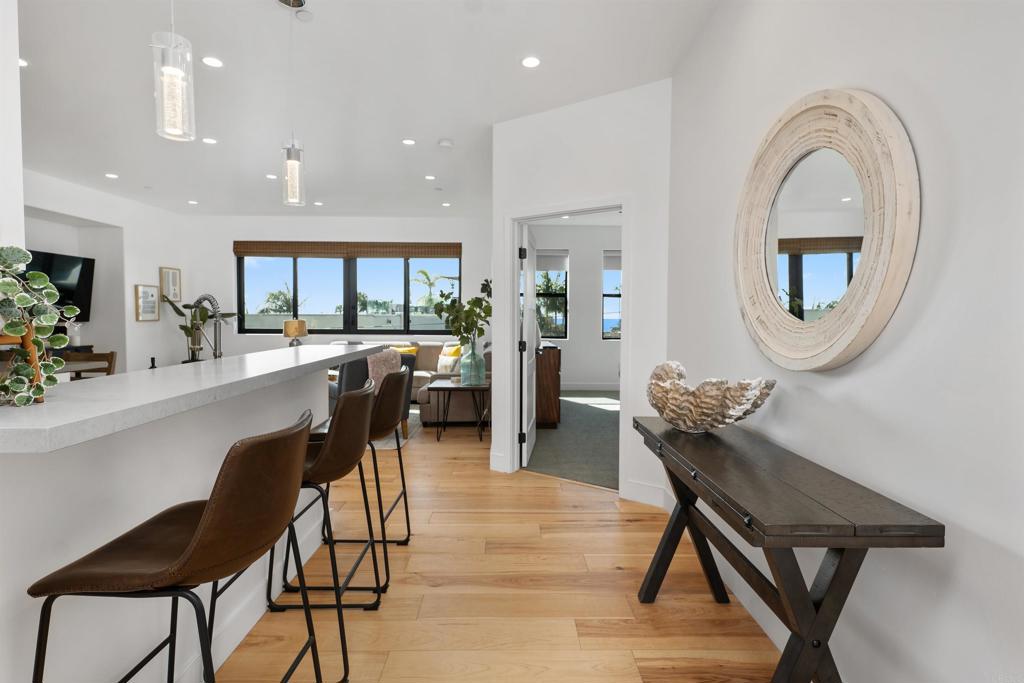 a dining room with furniture and a mirror