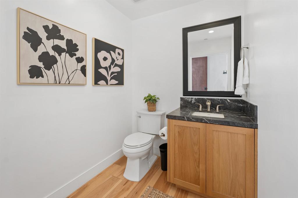 5656 La Jolla Boulevard, Unit 3 La Jolla, CA 92037 - Photo 14 of 35 a bathroom with a toilet sink and mirror