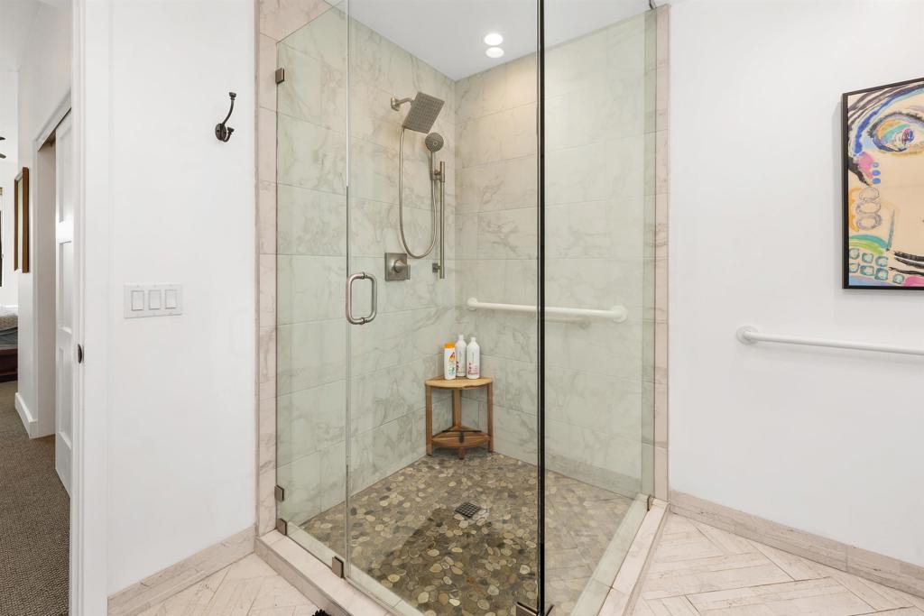 5656 La Jolla Boulevard, Unit 3 La Jolla, CA 92037 - Photo 20 of 35 a bathroom with a granite countertop shower and a toilet
