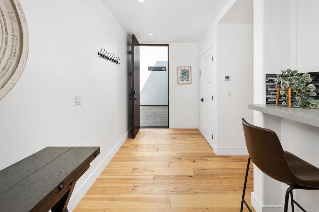 5656 La Jolla Boulevard, Unit 3 La Jolla, CA 92037 - Photo 4 of 35 a bedroom with a bed and a table in it