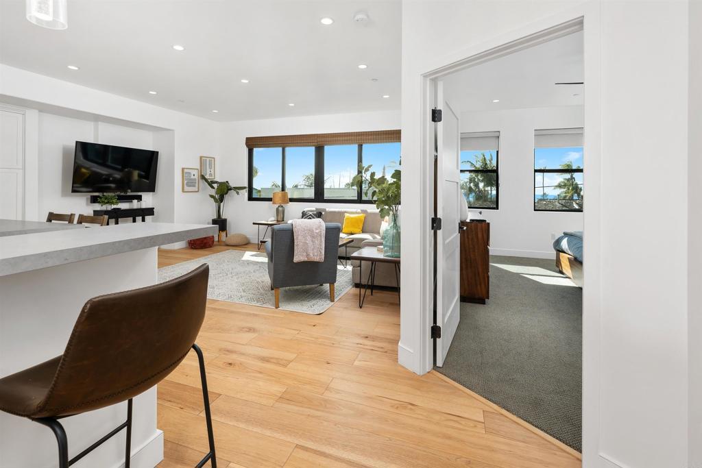 5656 La Jolla Boulevard, Unit 3 La Jolla, CA 92037 - Photo 5 of 35 a living room with furniture and a flat screen tv