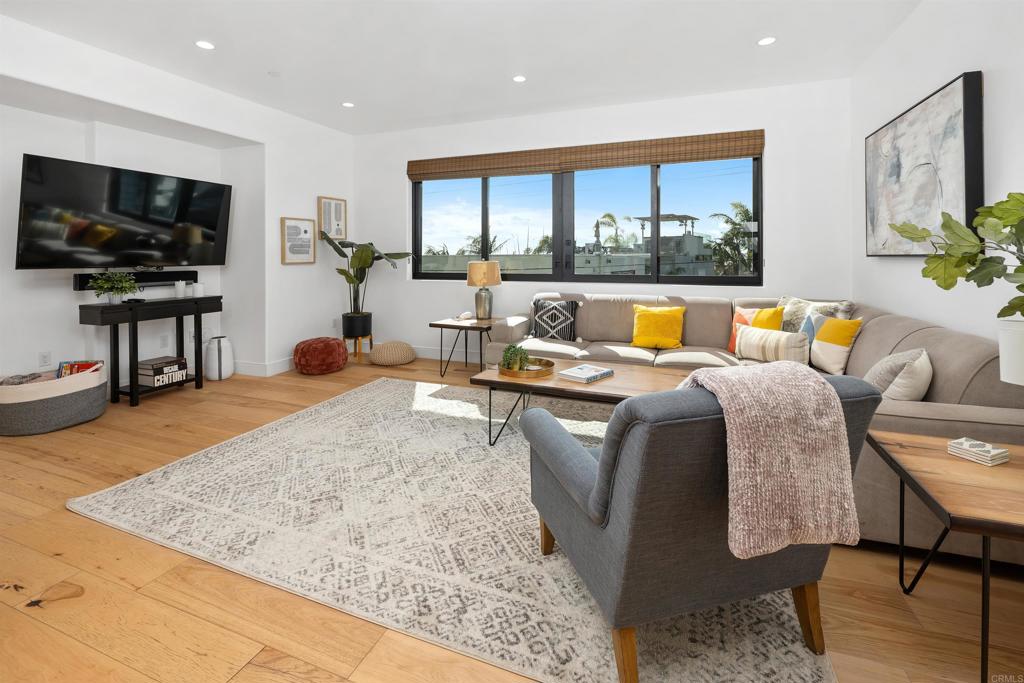 5656 La Jolla Boulevard, Unit 3 La Jolla, CA 92037 - Photo 7 of 35 a living room with furniture and a flat screen tv