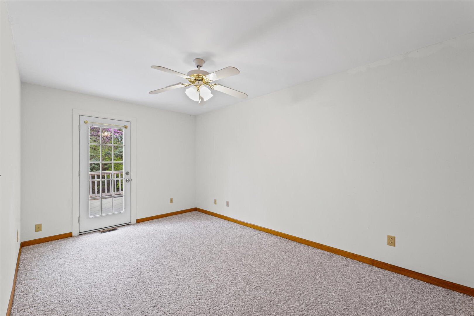 1706 Chevy Chase Drive Champaign, IL 61821 - Photo 12 of 29 an empty room with a window and a ceiling fan