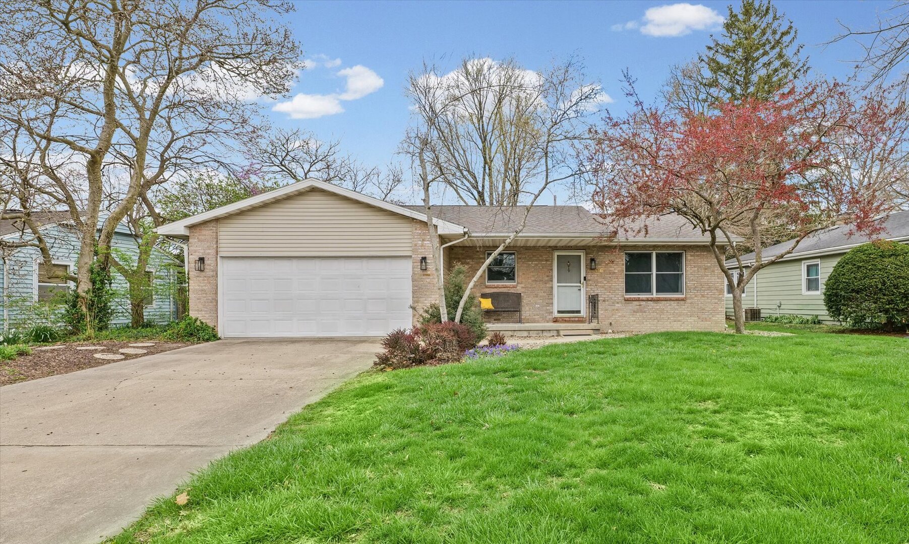 1706 Chevy Chase Drive Champaign, IL 61821 - Photo 2 of 29 a front view of a house with a yard and garage