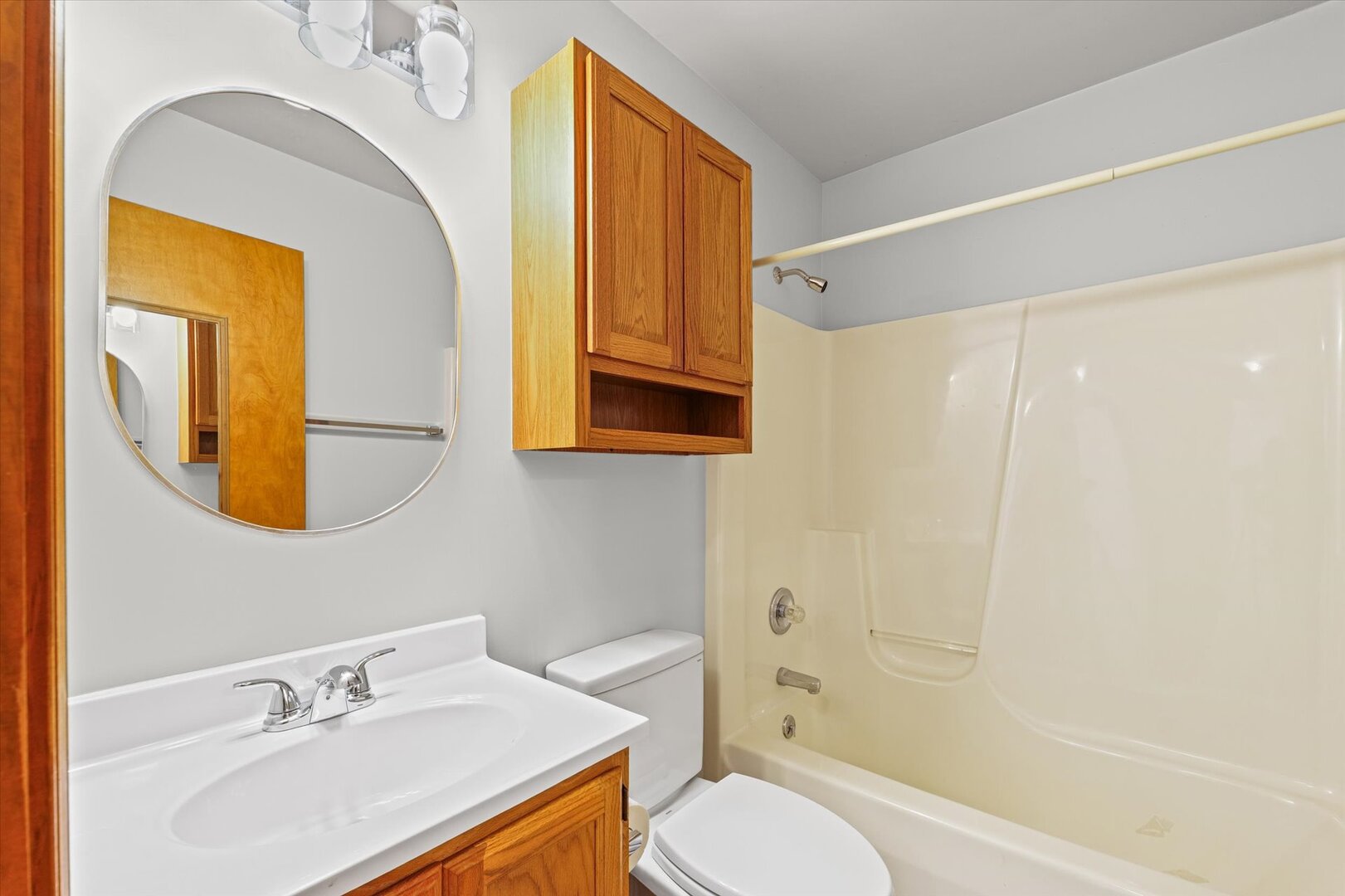 1706 Chevy Chase Drive Champaign, IL 61821 - Photo 8 of 29 a bathroom with a sink vanity mirror and toilet
