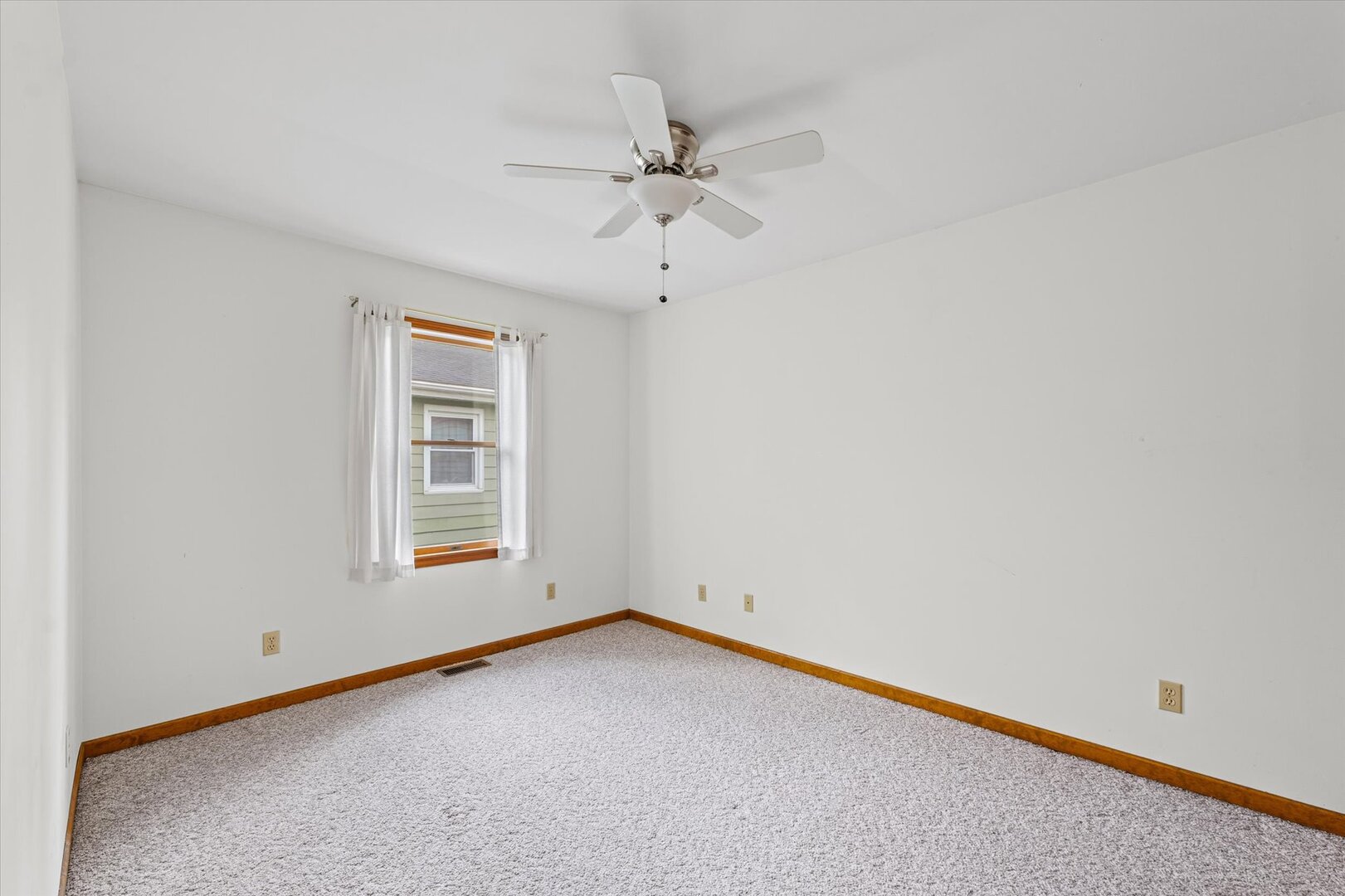 1706 Chevy Chase Drive Champaign, IL 61821 - Photo 10 of 29 an empty room with a ceiling fan and window