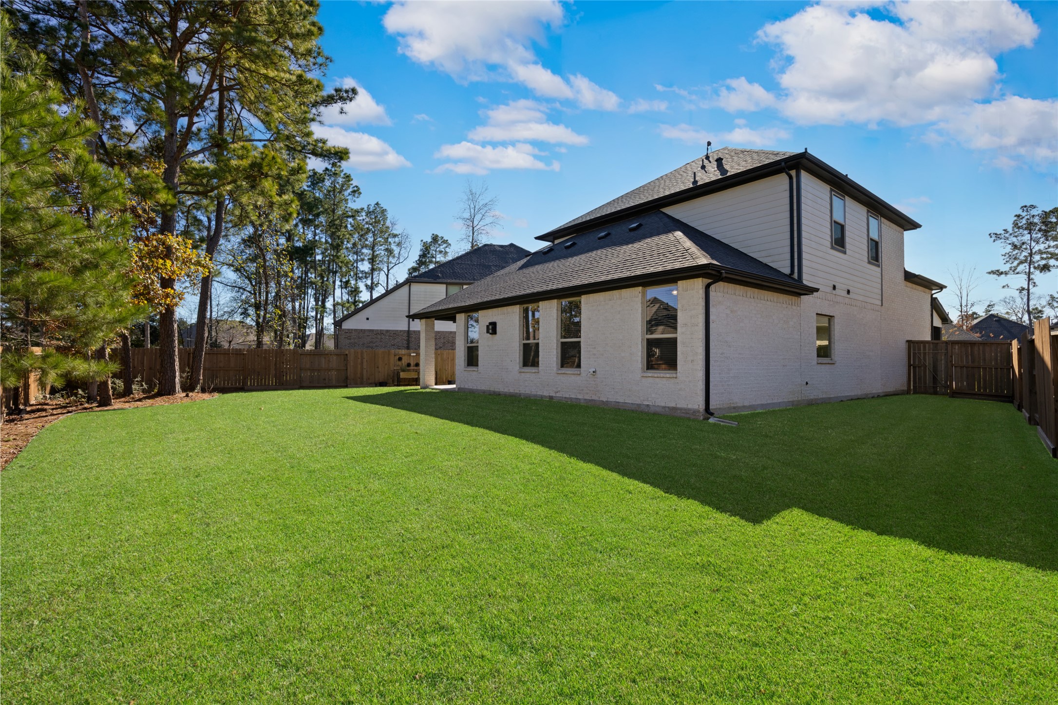 108 Yellow Perch Way Conroe, TX 77318 - Photo 44 of 50 a view of a house with backyard and garden