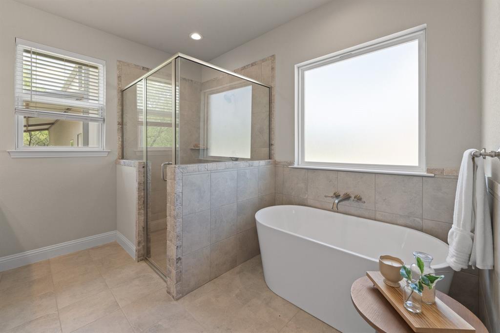 1001 Resolute Road Millsap, TX 76066 - Photo 18 of 40 a bathroom with a tub and a sink
