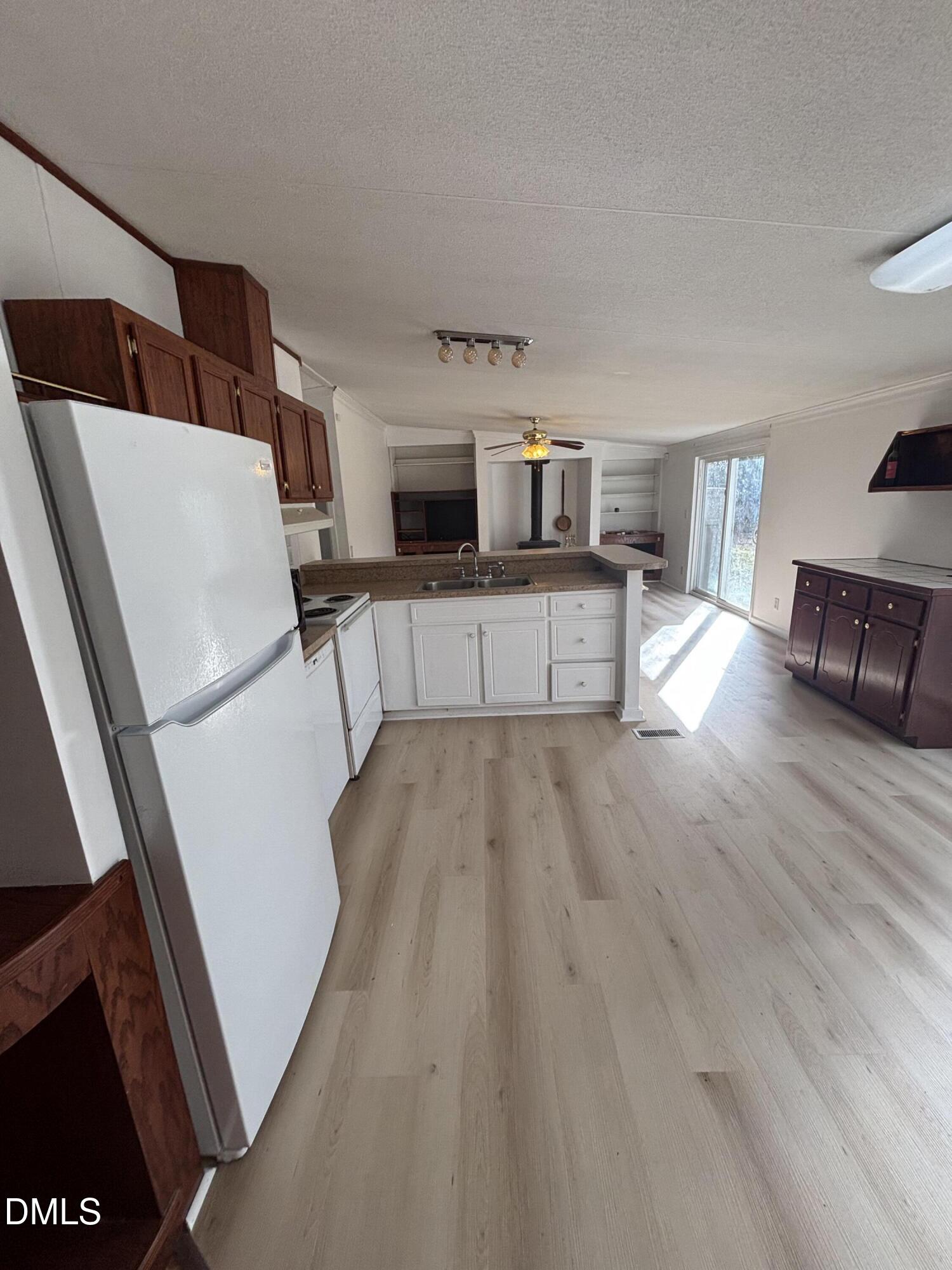 762 Shocco Springs Road Warrenton, NC 27589 - Photo 12 of 24 a kitchen with stainless steel appliances a refrigerator and a stove top oven