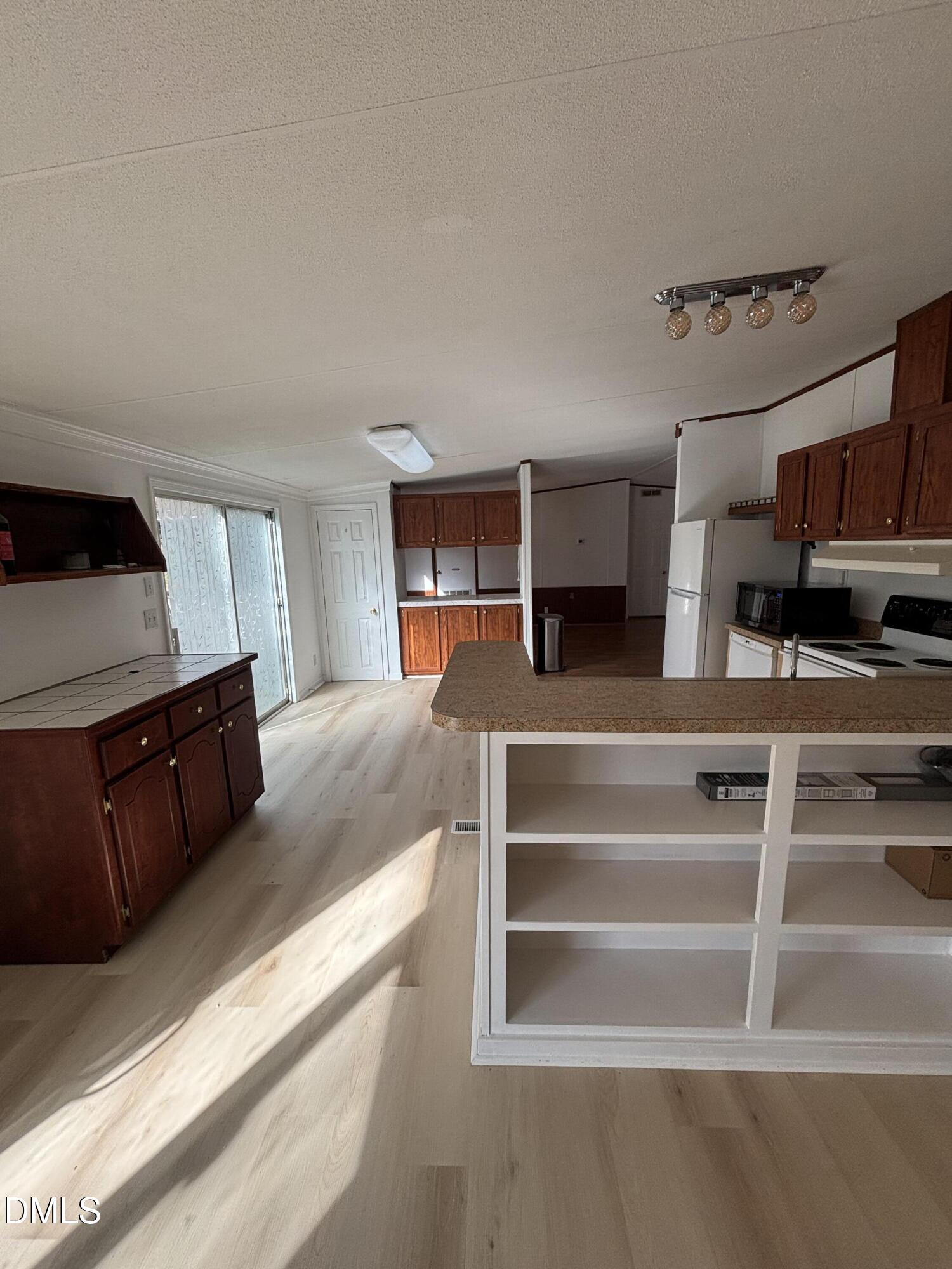 762 Shocco Springs Road Warrenton, NC 27589 - Photo 14 of 24 a living room with furniture and a flat screen tv