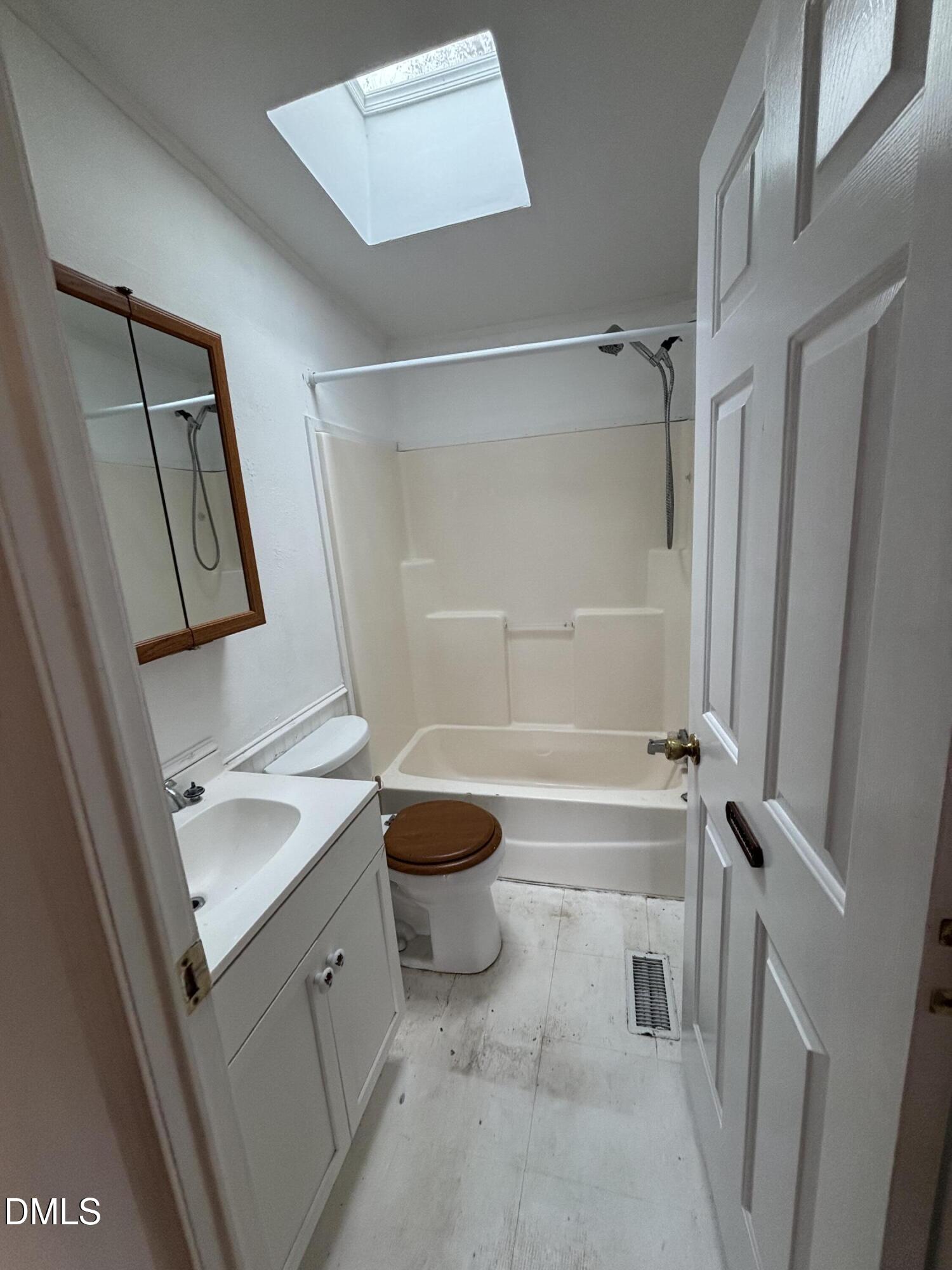 762 Shocco Springs Road Warrenton, NC 27589 - Photo 18 of 24 a bathroom with a granite countertop sink toilet and shower