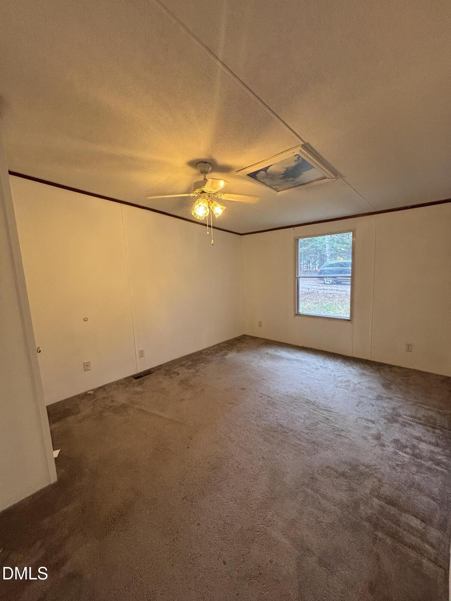 762 Shocco Springs Road Warrenton, NC 27589 - Photo 19 of 24 an empty room with a empty space and windows