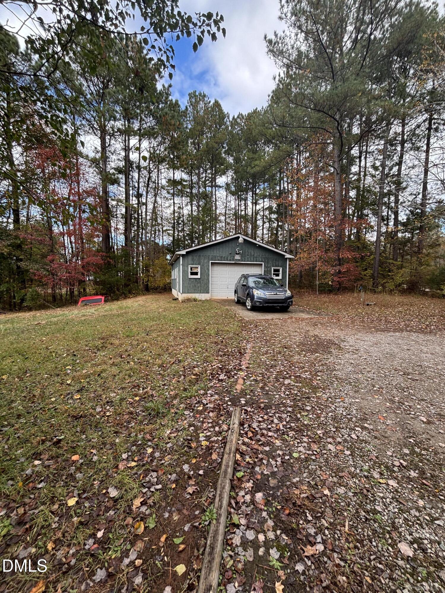 762 Shocco Springs Road Warrenton, NC 27589 - Photo 4 of 24 a view of a house with a yard and trees