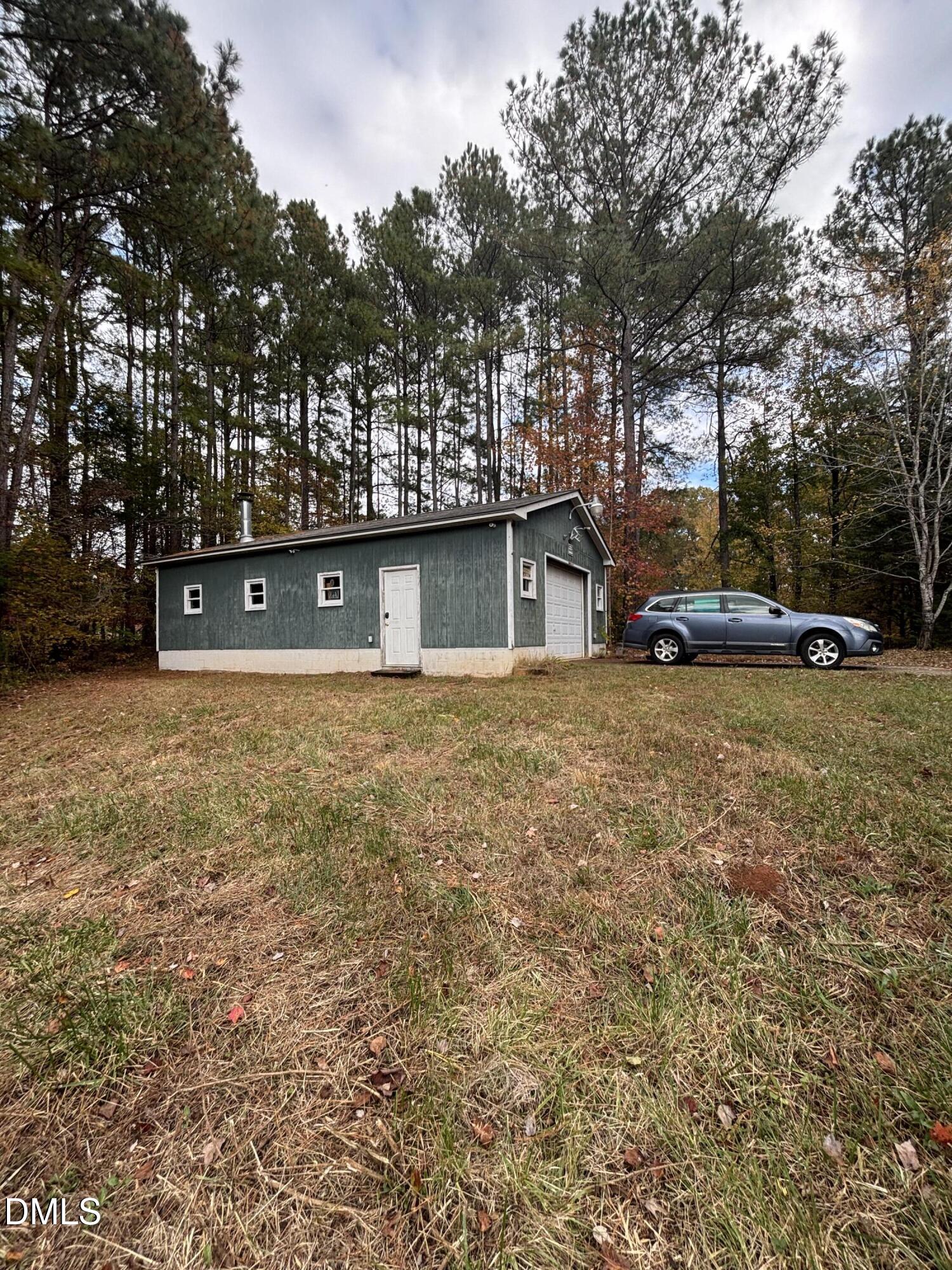 762 Shocco Springs Road Warrenton, NC 27589 - Photo 5 of 24 a view of a house with a yard and sitting area