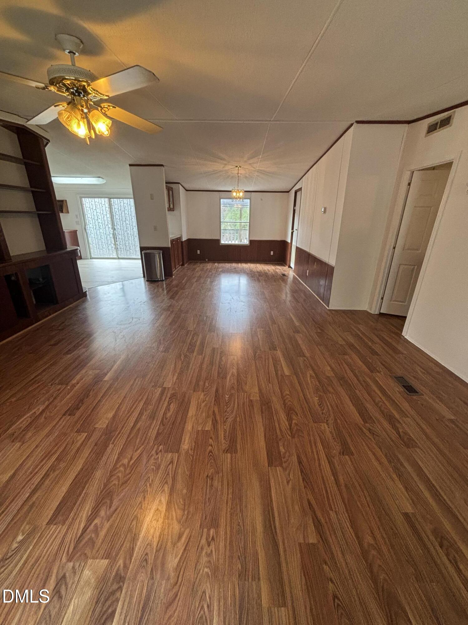 762 Shocco Springs Road Warrenton, NC 27589 - Photo 6 of 24 a view of empty room with wooden floor