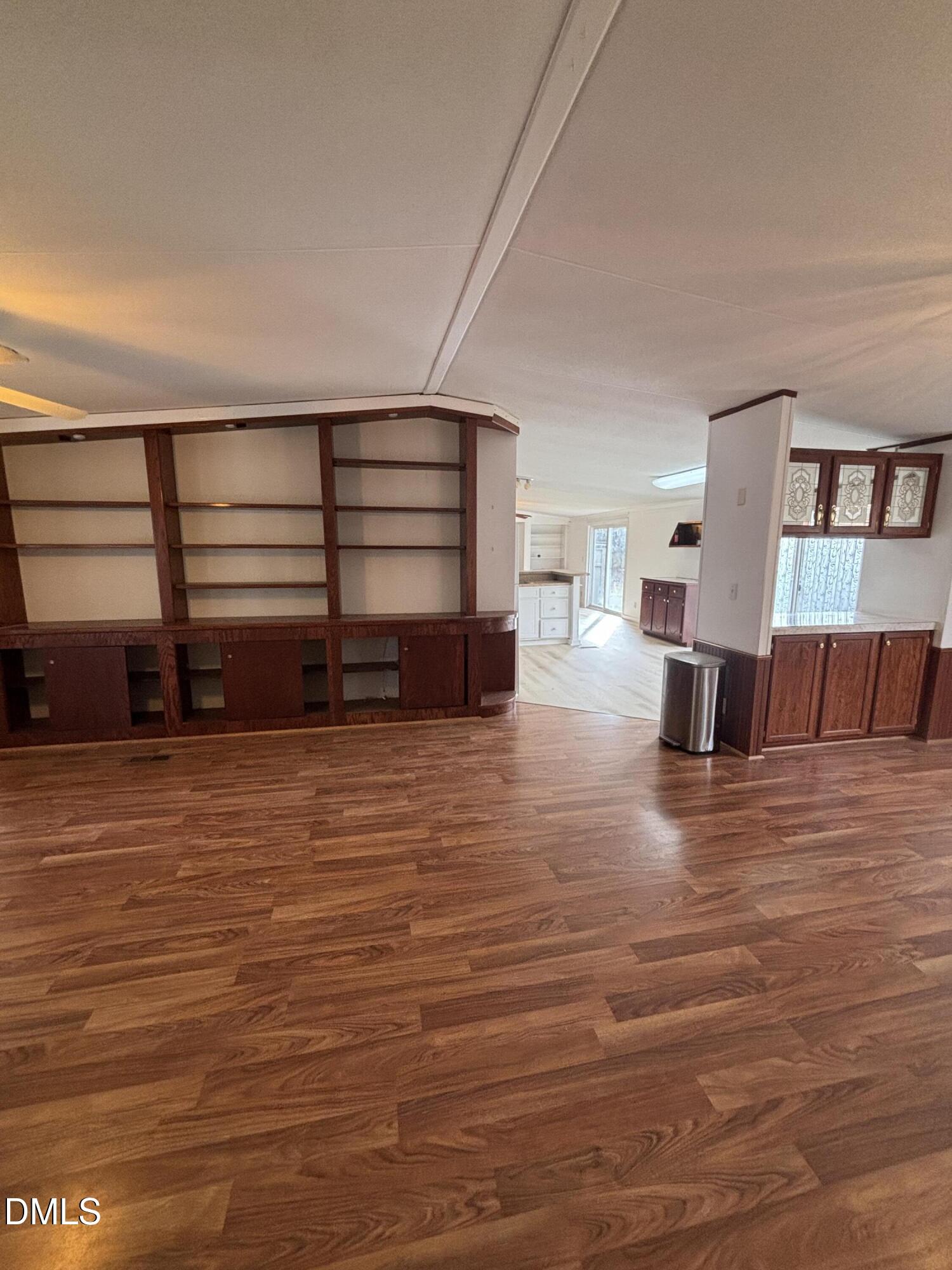 762 Shocco Springs Road Warrenton, NC 27589 - Photo 8 of 24 a view of a room with wooden floor and furniture