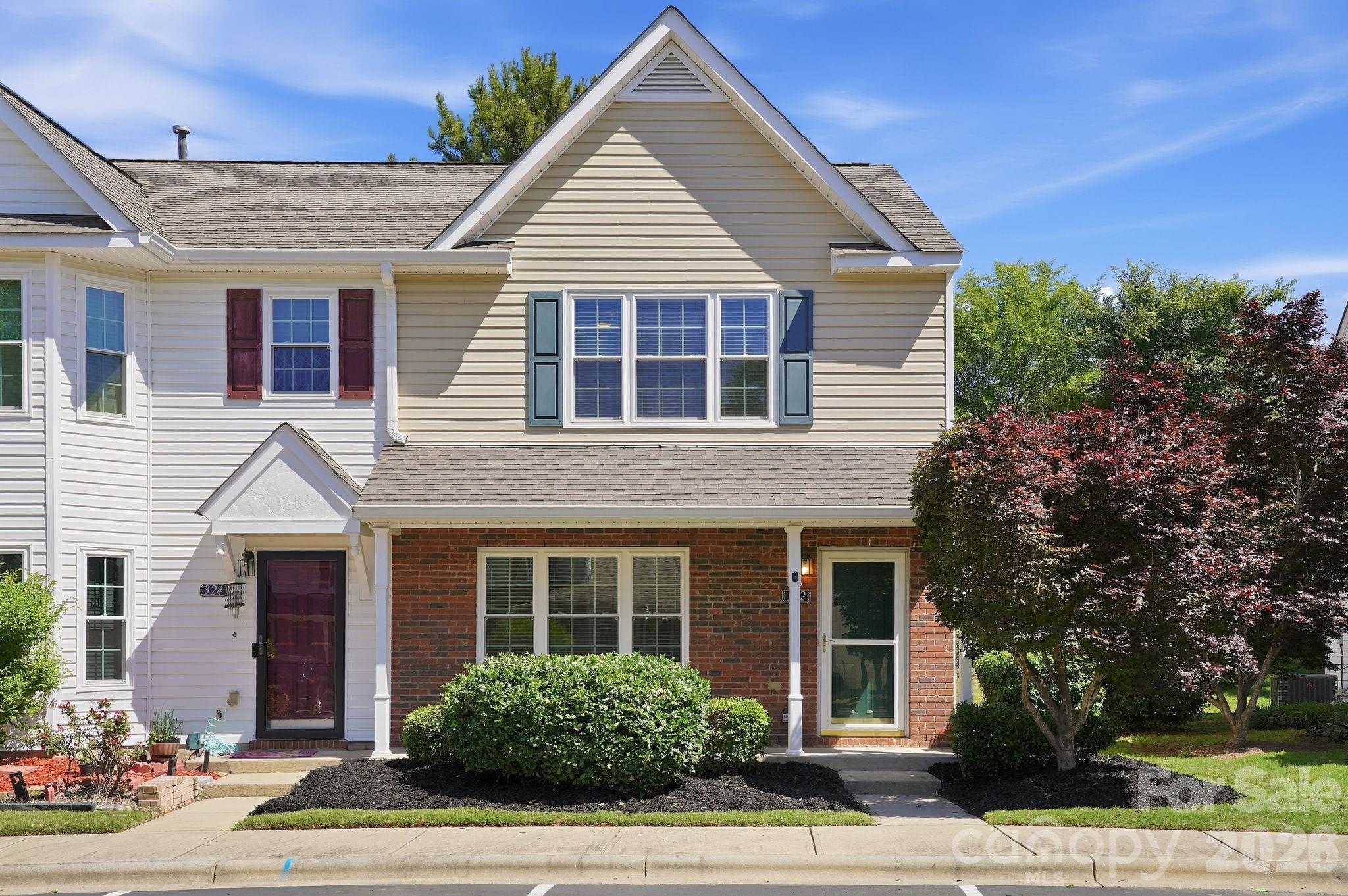 322 Deep Water Lane Fort Mill, SC 29715 - Photo 2 of 29 a view of a house with a yard and potted plants