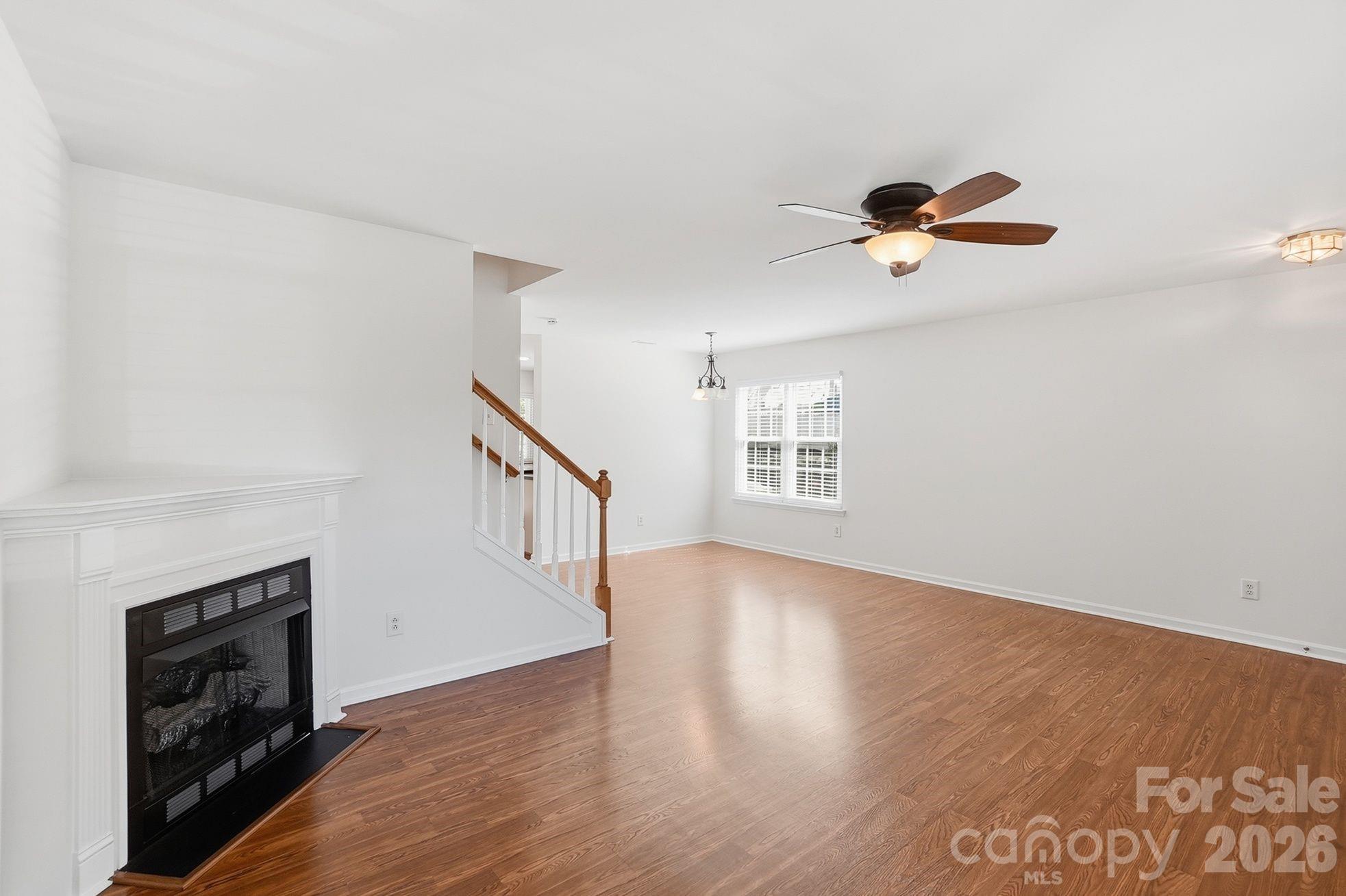 322 Deep Water Lane Fort Mill, SC 29715 - Photo 3 of 29 wooden floor in an empty room with a window