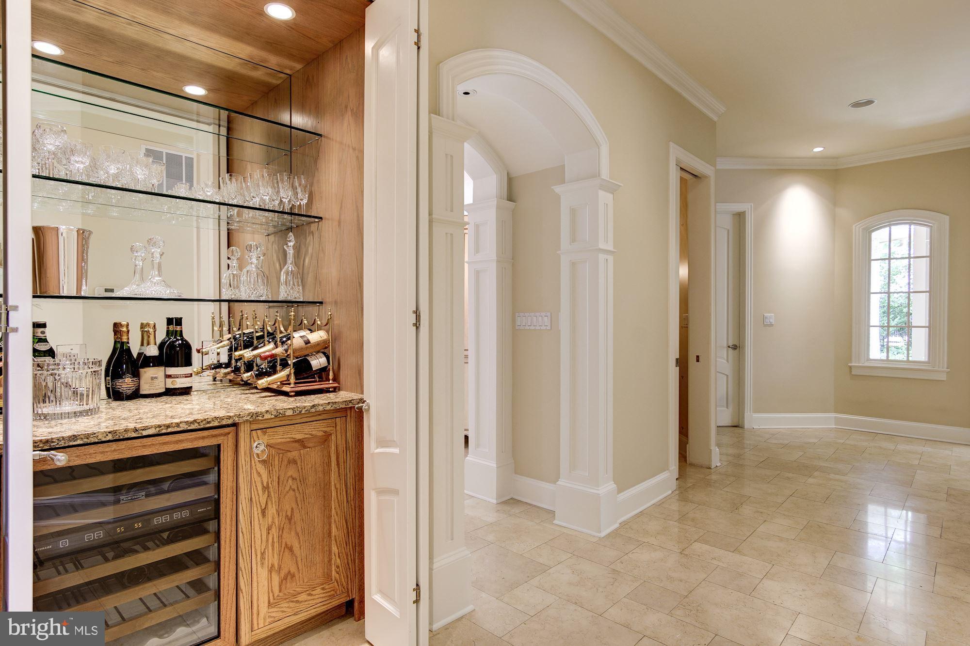 7112 Armat Drive Bethesda, MD 20817 - Photo 20 of 47 Bar with wine fridge and graceful design